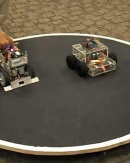 Photo showing two SumoBots on a round, demonstration platform.